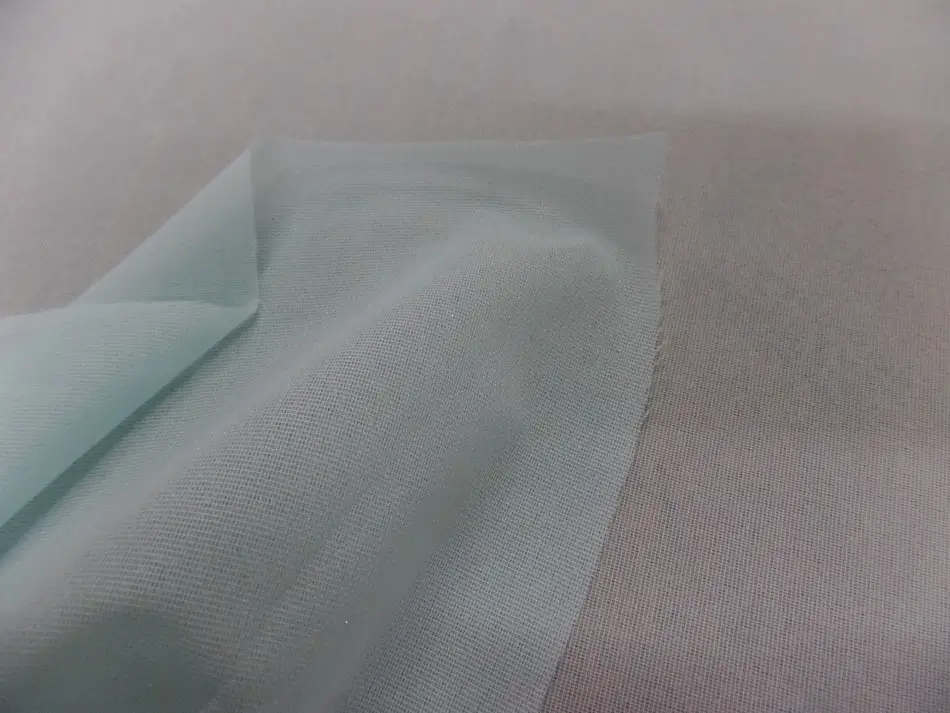 Toile collante bleue fine légèrement extensible : entoilage type toile pour maintien propre